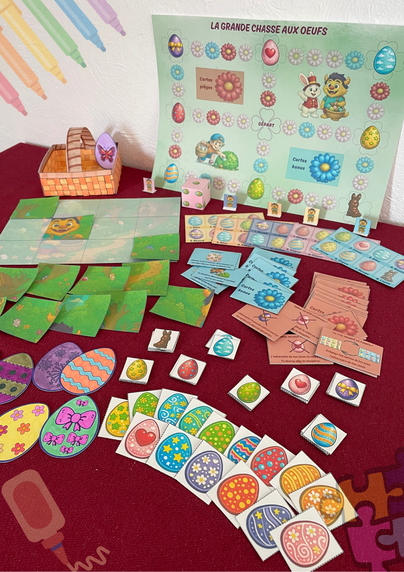 Création d'un panier en osier en papier, d'un puzzle, d'oeuf à décorer et colorier, un plateau jeu en mode grande chasse aux oeufs avec un dé, des pions, des cartes pièges et bonus et un lapin en chocolat. 