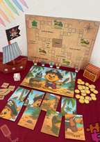 Créations sur le thème des pirate avec création d'un bateau et drapeaux puis d'un coffre fort avec des pièces. Puzzle et jeu de plateau avec pions en bateaux pour trouver le trésor. 
